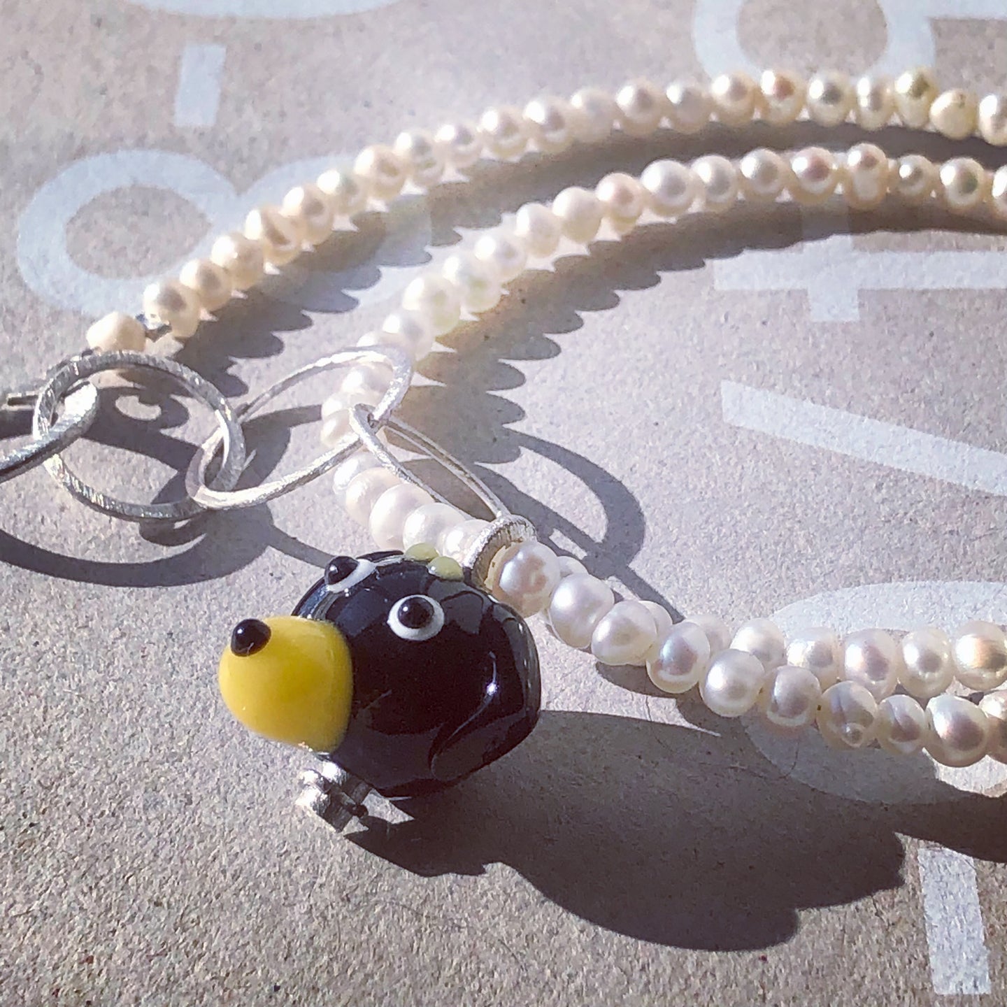 collar perlas y salchicha